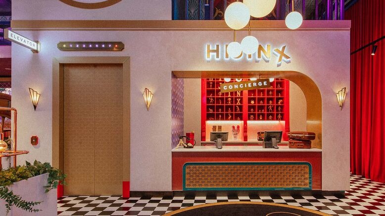 Front desk of Hijinx Hotel Surfers Paradise, one of the most playful and family-friendly Surfers Paradise attractions, featuring bold colors, quirky design, and immersive game rooms.